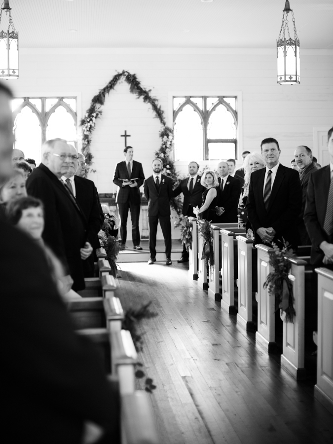 groom's reaction to seeing the bride come down the aisle 