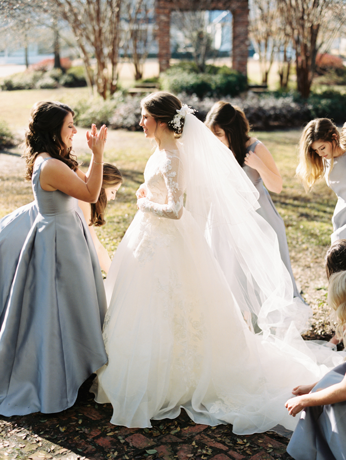 bridesmaids see the bride for the first time at southern winter wedding