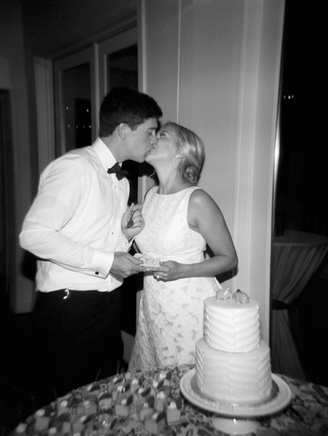 Timeless Wedding image of the bride and groom cutting their wedding cake. 