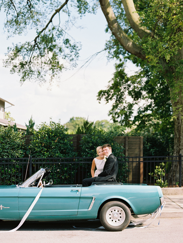 Bride & Groom get portraits done in there classic getaway convertible car in Nashville, TN