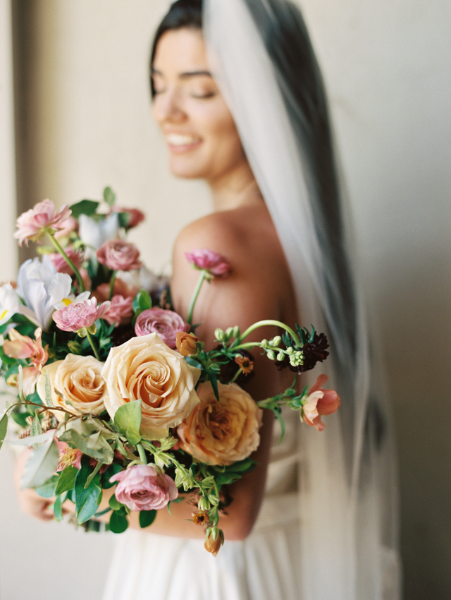 romantic bridal portrait with bride holding lush, full and colorful bouquet located in Chattanooga, TN