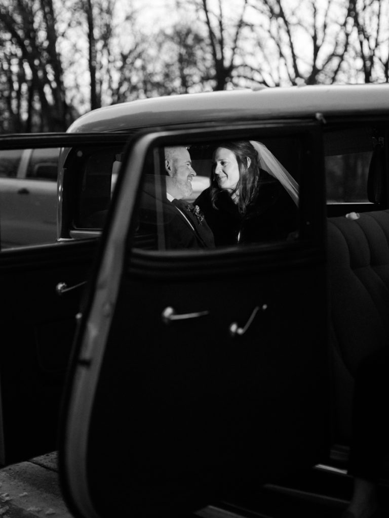 black and white film photograph in vintage getaway car 