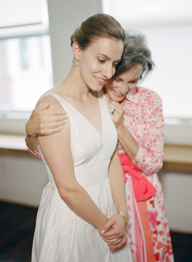 Nashville wedding photographer captures intimate moment between mom and bride getting ready in nashville, tennessee 