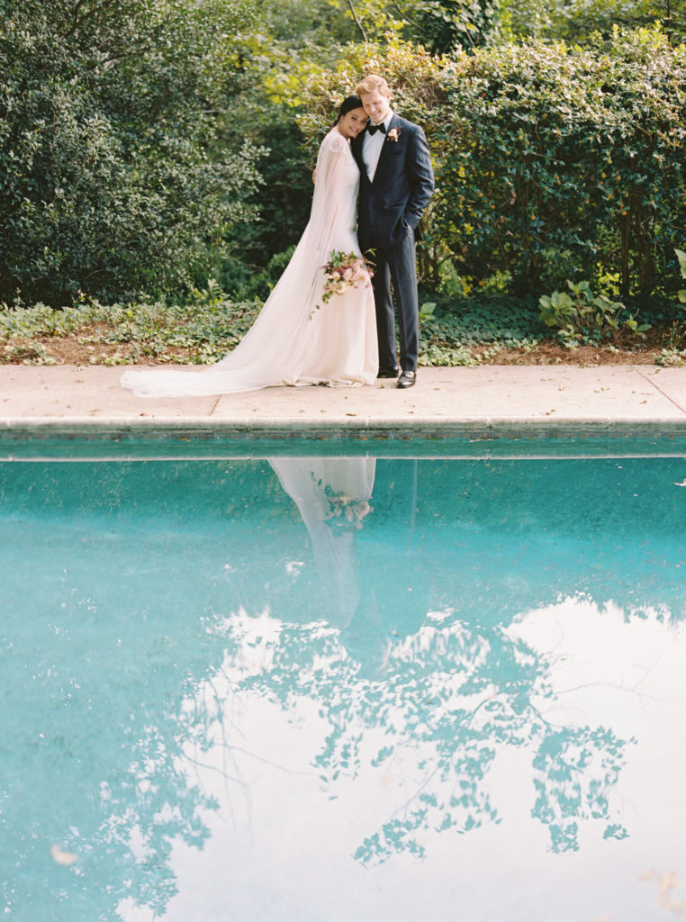 modern timeless wedding gown with veil cape at Meadowlark 1939 intimate wedding venue in Atlanta, Georgia shot by film wedding photographer Abigail Lewis Photography 