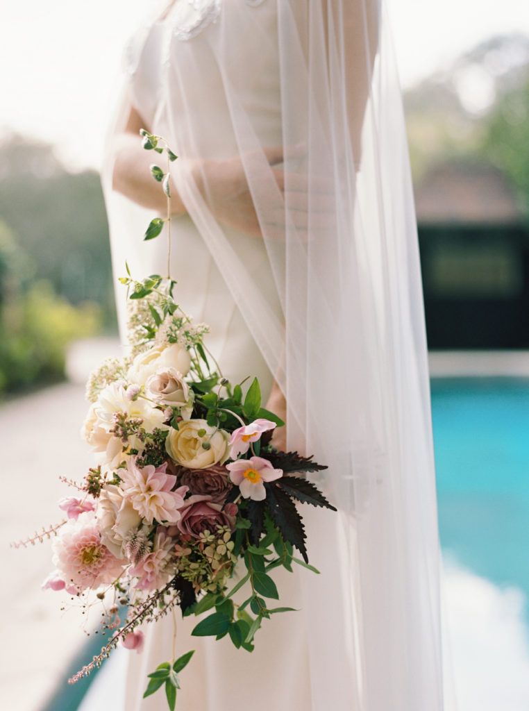 colorful late summer bouquet at modern timeless wedding gown with veil cape at Meadowlark 1939 intimate wedding venue in Atlanta, Georgia shot by film wedding photographer Abigail Lewis Photography 