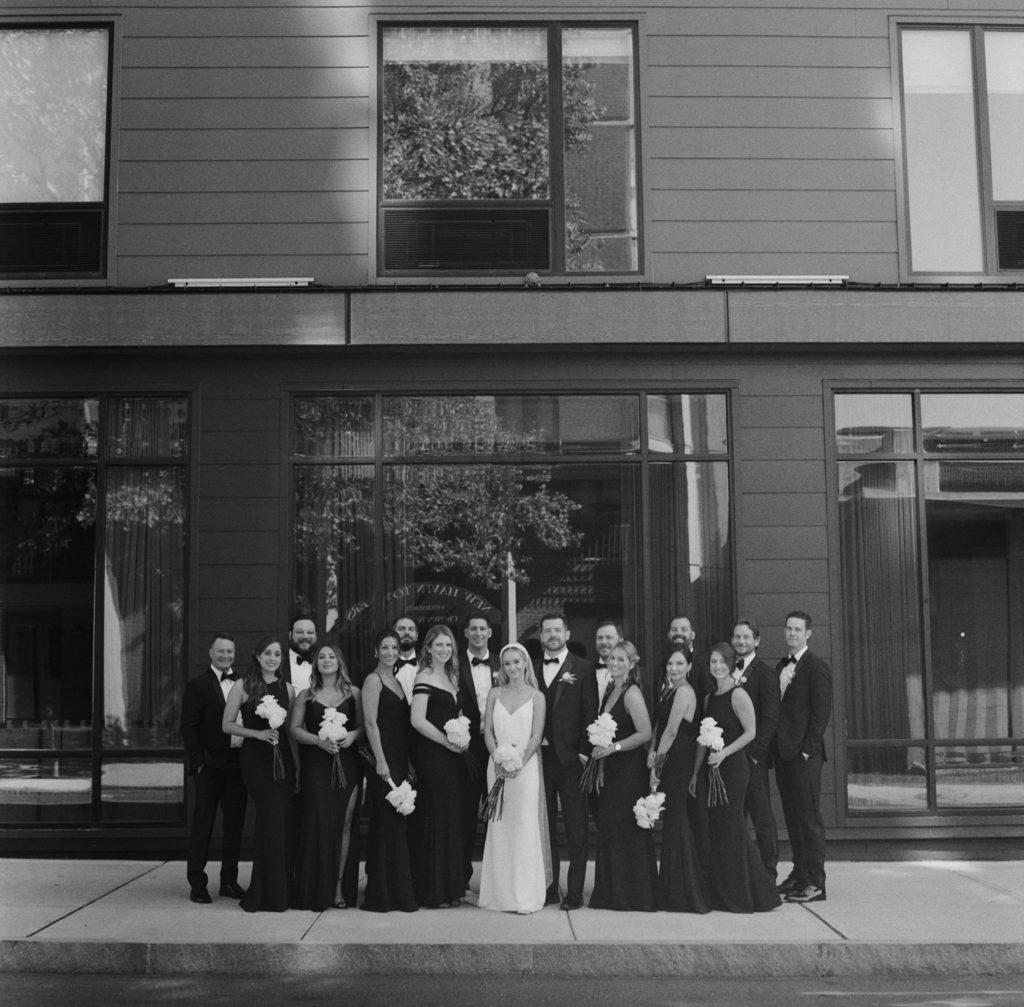 new haven wedding party in black and white film shot outside the Blake Hotel New Haven Connecticut and scanned and processed by Photovision Film Lab